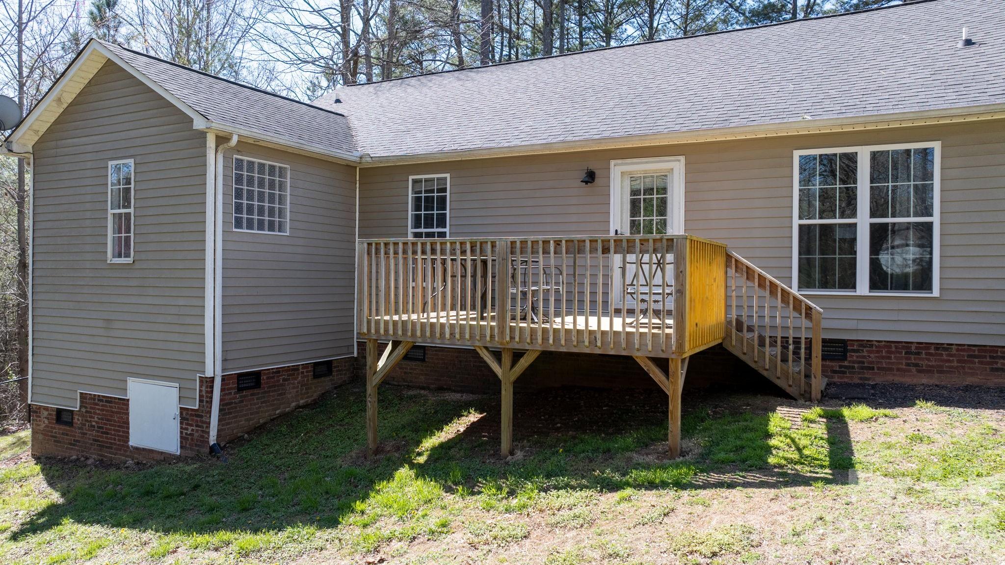 120 Wesley Court Crouse, NC 28033 - Photo 12 of 36 a view of a house with a yard and deck