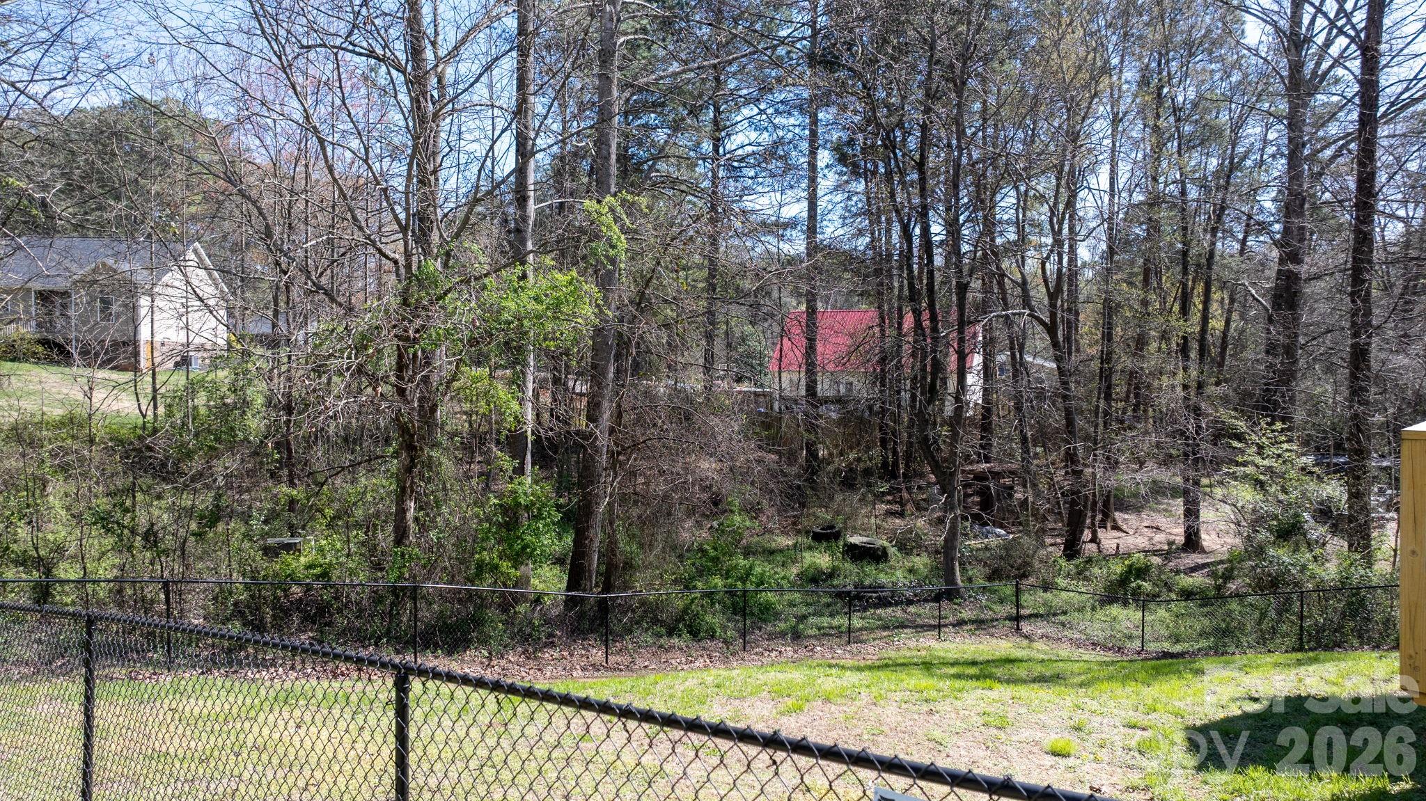 120 Wesley Court Crouse, NC 28033 - Photo 15 of 36 a front view of a house with a yard and a large tree