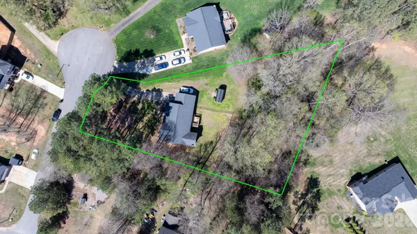 an aerial view of residential house with outdoor space