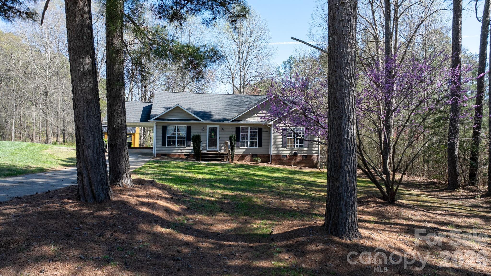120 Wesley Court Crouse, NC 28033 - Photo 2 of 36 a front view of a house with garden