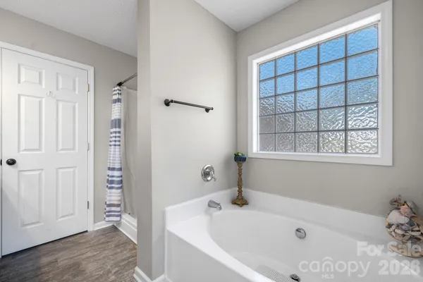 a white bath tub sitting in a bathroom