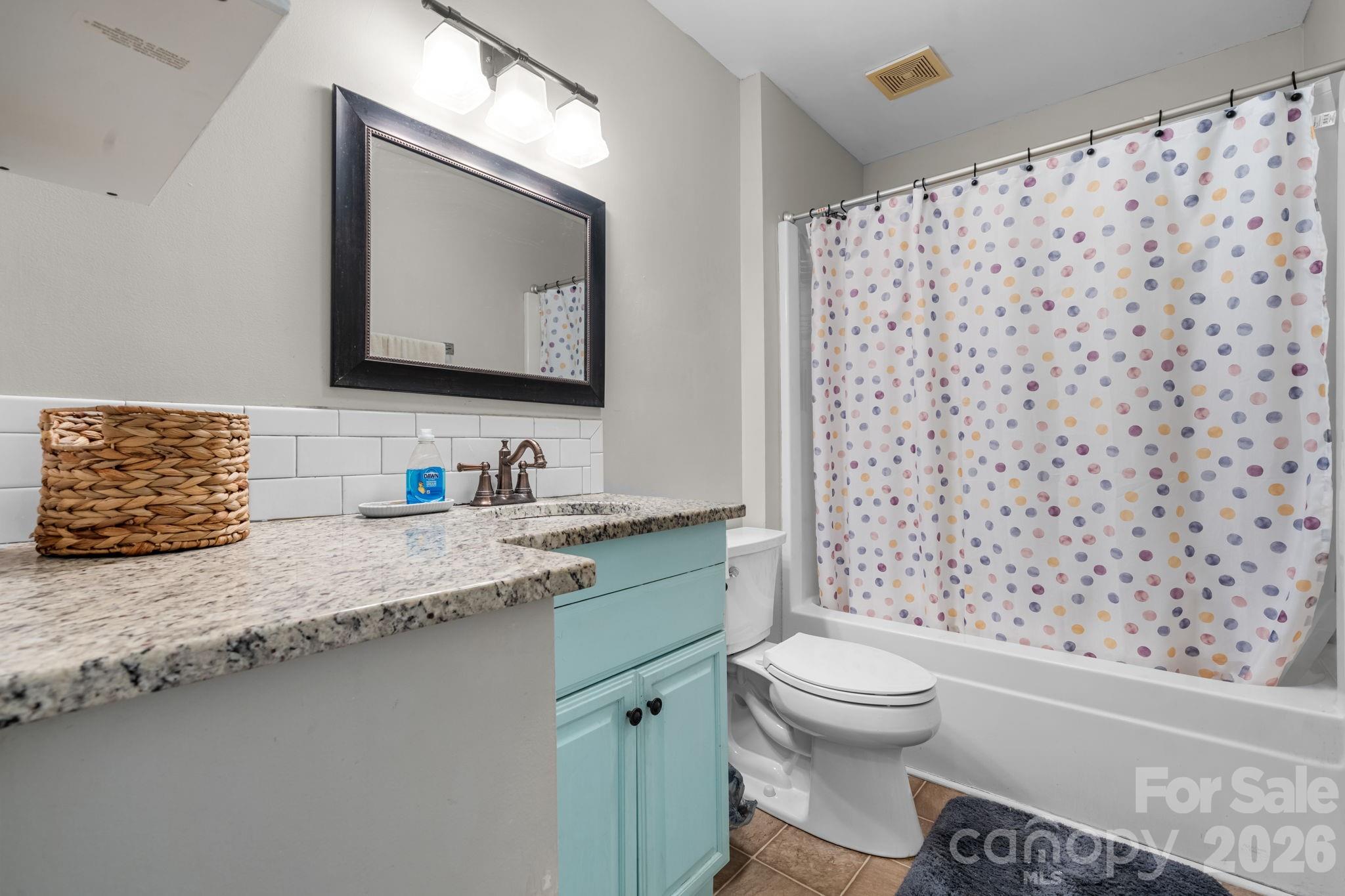 120 Wesley Court Crouse, NC 28033 - Photo 28 of 36 a bathroom with a granite countertop sink toilet mirror and shower