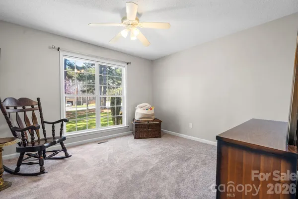 a living room with furniture or couch and a wooden floor