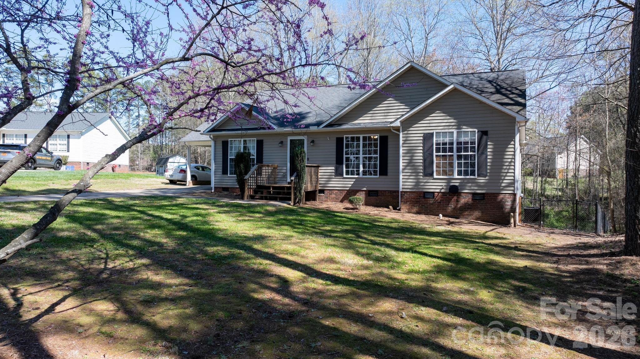 120 Wesley Court Crouse, NC 28033 - Photo 3 of 36 a front view of a house with garden