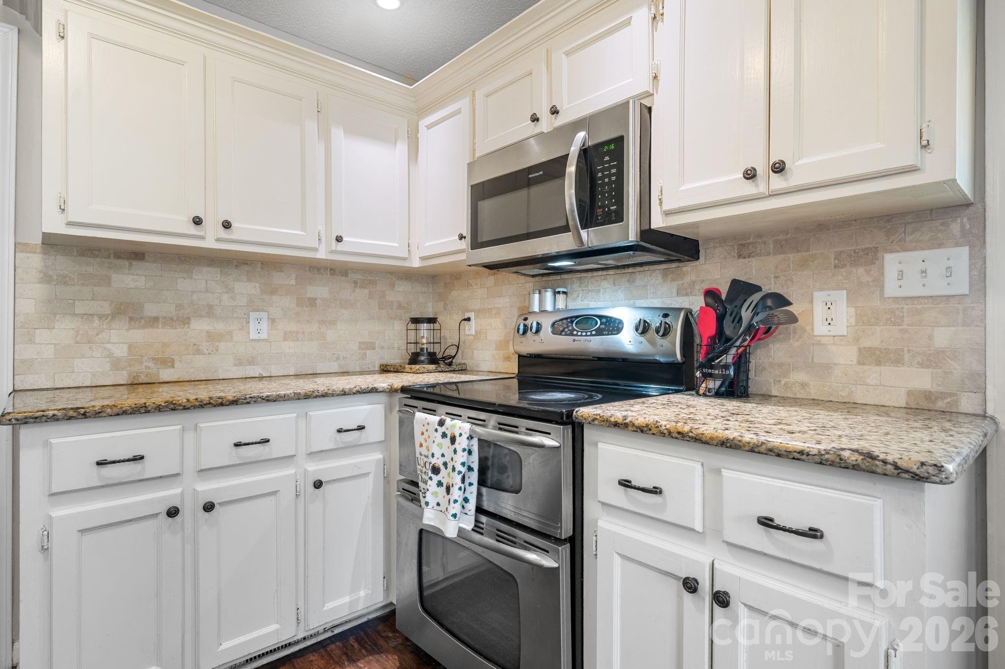 120 Wesley Court Crouse, NC 28033 - Photo 36 of 36 a kitchen with stainless steel appliances granite countertop white cabinets sink and dishwasher
