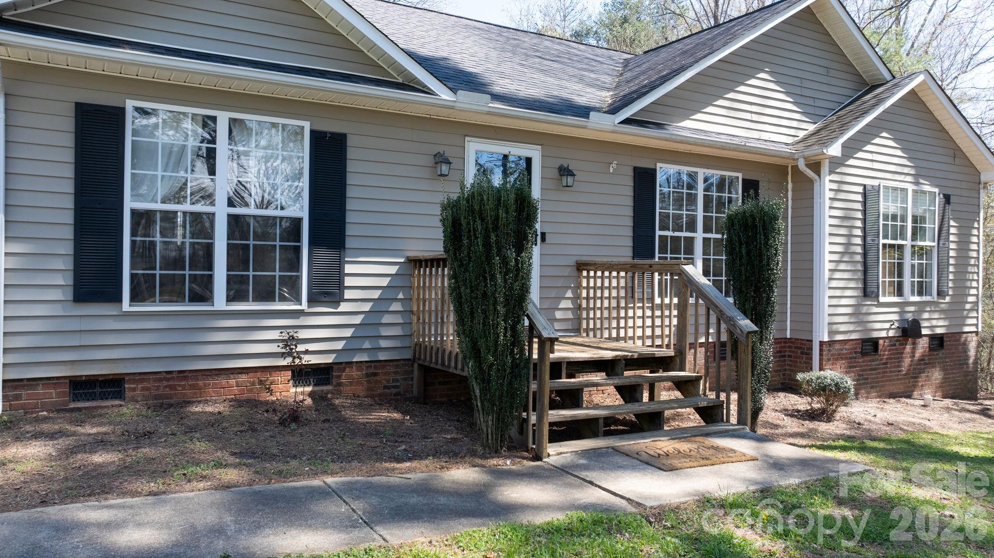 120 Wesley Court Crouse, NC 28033 - Photo 6 of 36 a front view of a house with garden