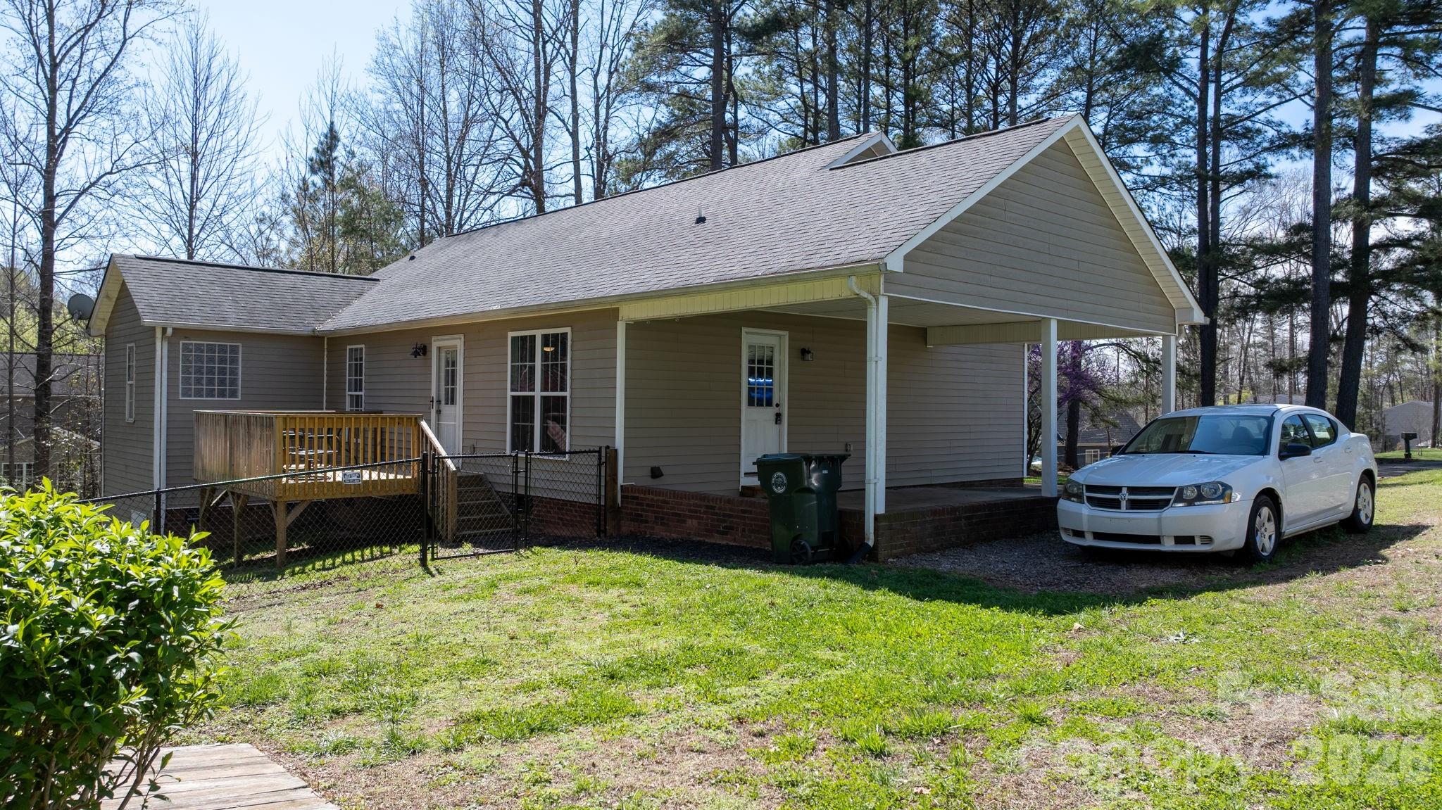 120 Wesley Court Crouse, NC 28033 - Photo 10 of 36 a front view of a house with a garden and yard