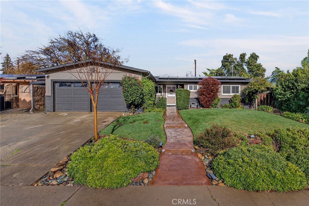 27 Amber Way Chico, CA 95926 - Photo 1 of 1 a front view of a house with a yard