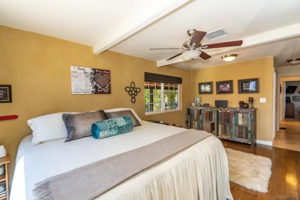 a bedroom with furniture and a window