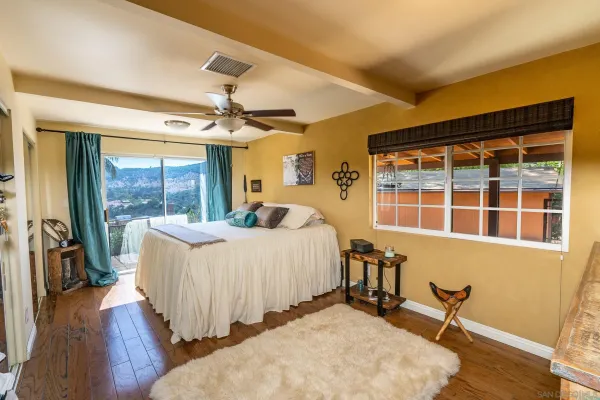 a bedroom with furniture and a window