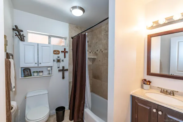 a view of a livingroom with workspace and a window