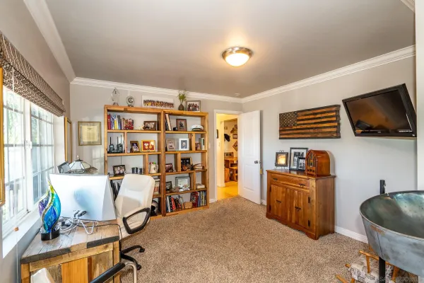 a view of a chairs and table in patio