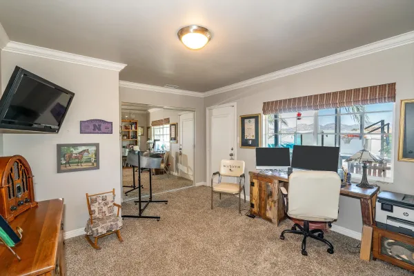 a view of a patio with furniture and a yard