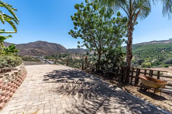 a view of a backyard of the house