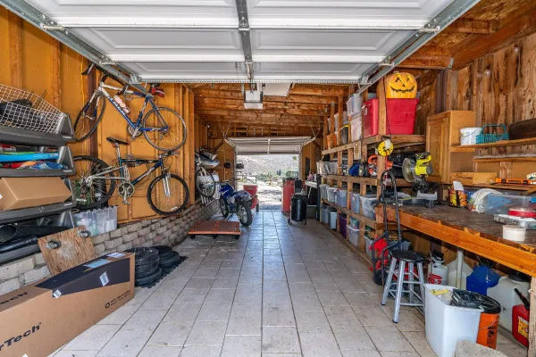a view of a dry yard with a house in the background