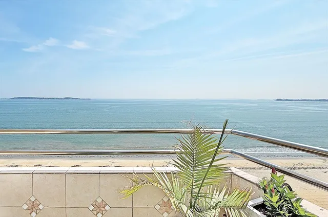 a view of a swimming pool and an outdoor seating