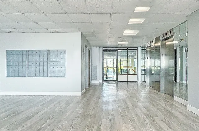 a view of an empty room with glass door