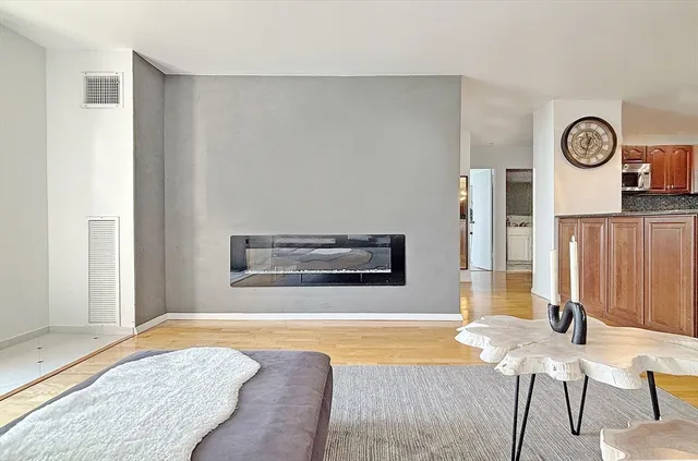 a bedroom with a bed and a chair in it