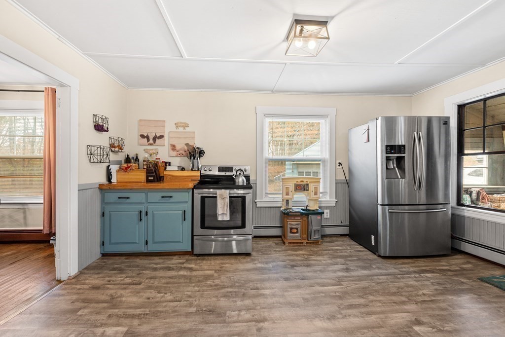 48 Hadley Road Merrimac, MA 01860 - Photo 4 of 27 a kitchen with stainless steel appliances a refrigerator and a stove