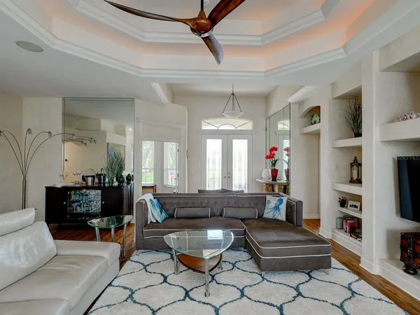 a living room with furniture and a fireplace