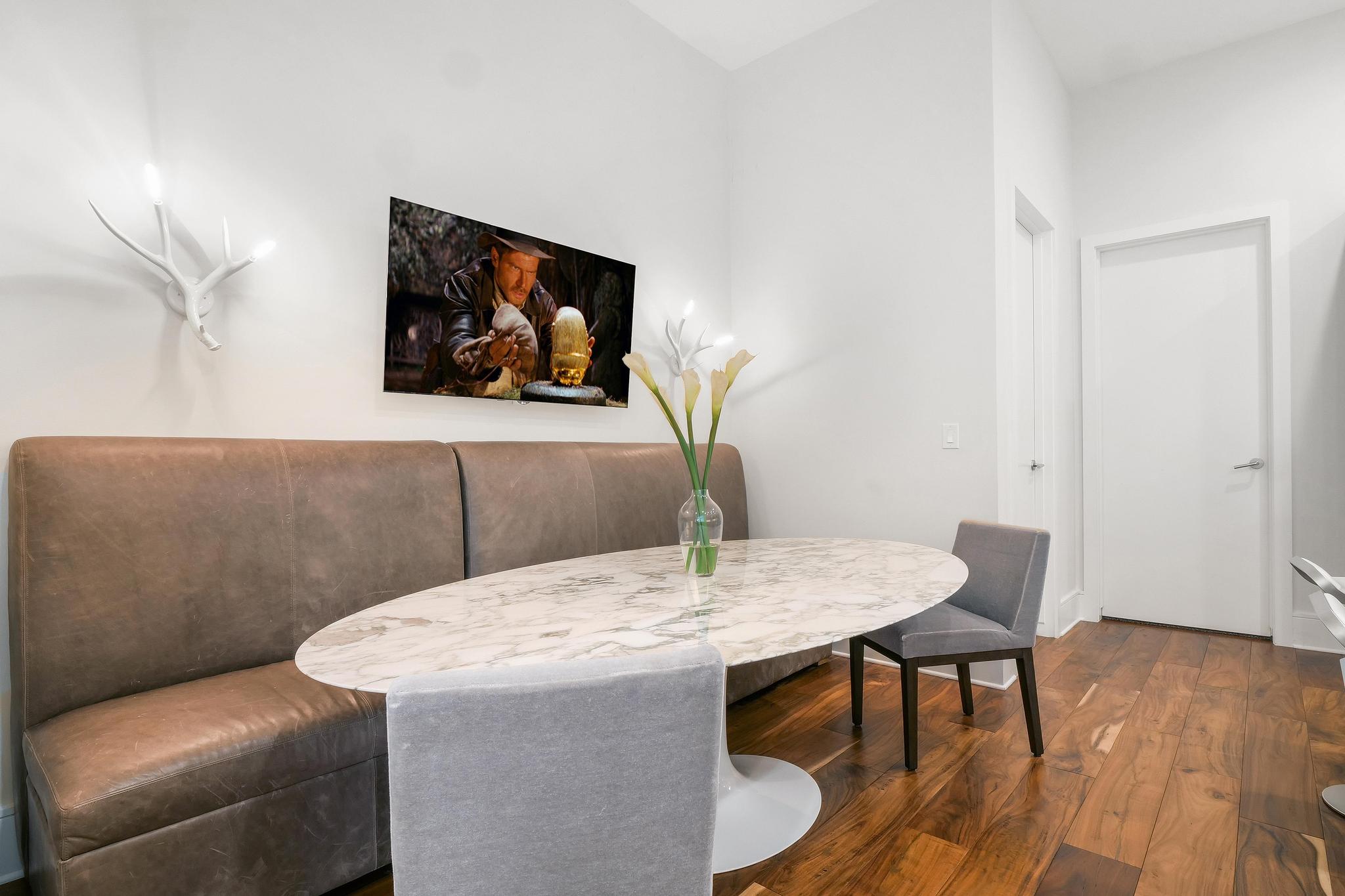 555 East 5th Street, Unit 3022 Austin, TX 78701 - Photo 15 of 40 Dining space with hardwood / wood-style flooring and baseboards