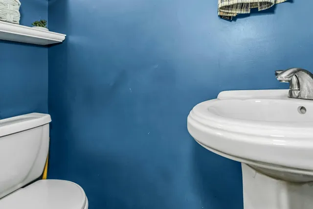 a bathroom with a toilet and a sink