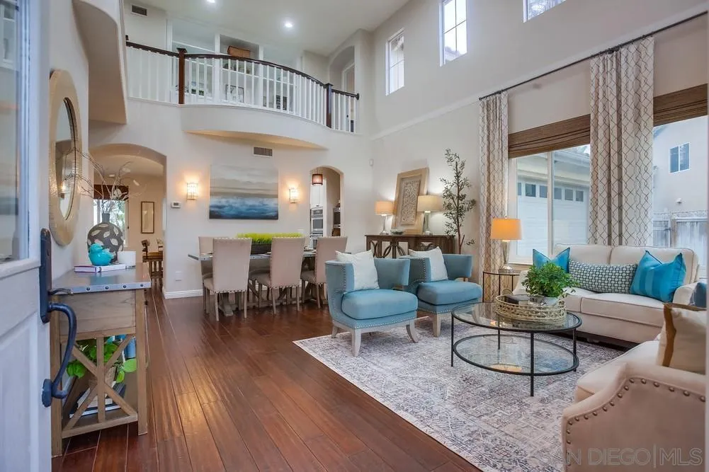 2150 Corte Cidro Carlsbad, CA 92009 - Photo 4 of 49 a living room with furniture kitchen view and a wooden floor