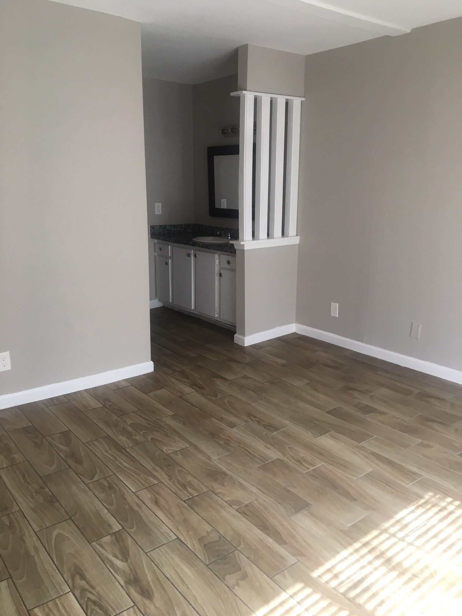 6200 West Tidwell Road, Unit 901 Houston, TX 77092 - Photo 10 of 12 a view of kitchen with wooden floor and electronic appliances