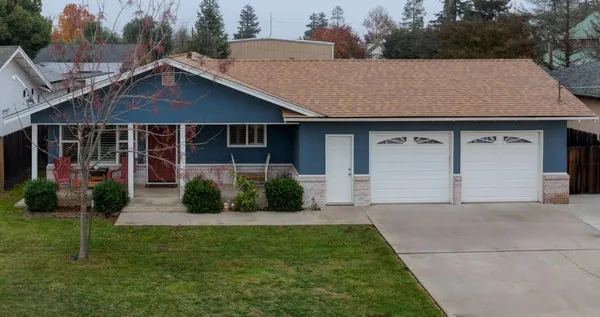 a front view of a house with garden