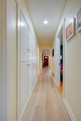 a view of an entryway with wooden floor