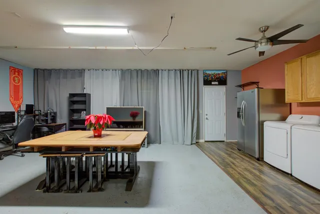 a dining room with furniture and window