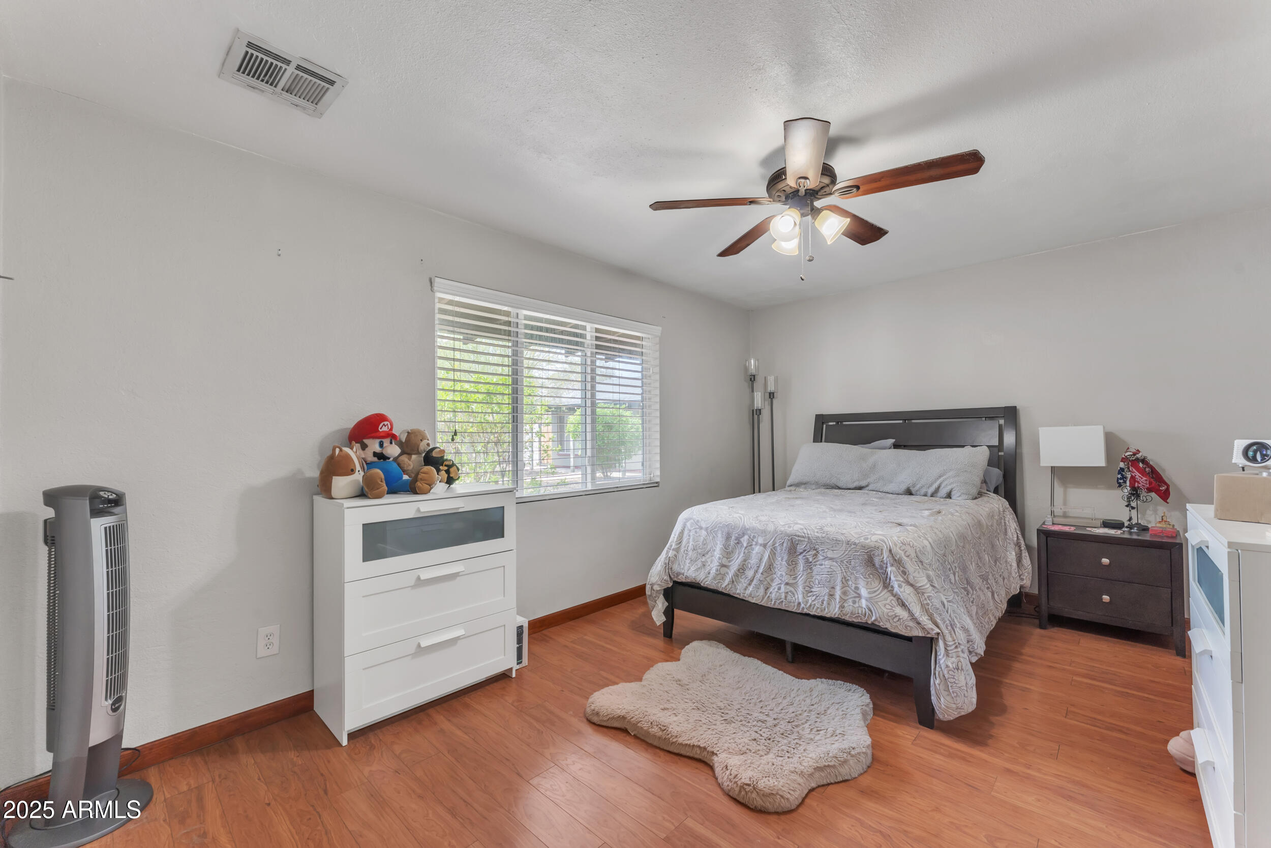 1024 East Mitchell Drive Phoenix, AZ 85014 - Photo 11 of 44 a bedroom with a bed and a window
