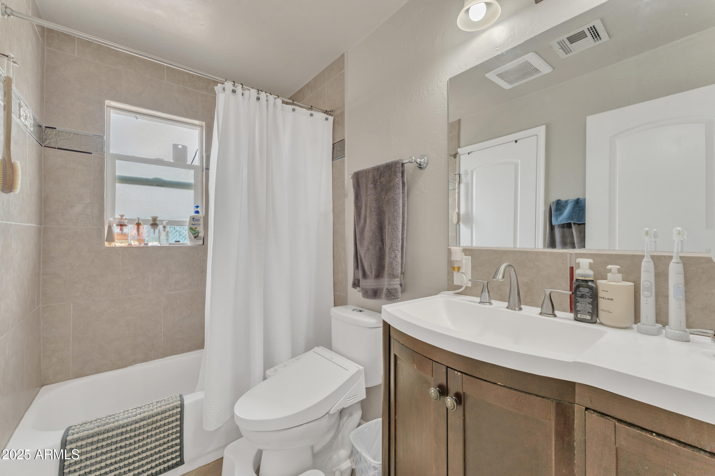 1024 East Mitchell Drive Phoenix, AZ 85014 - Photo 32 of 44 a bathroom with a sink toilet and shower