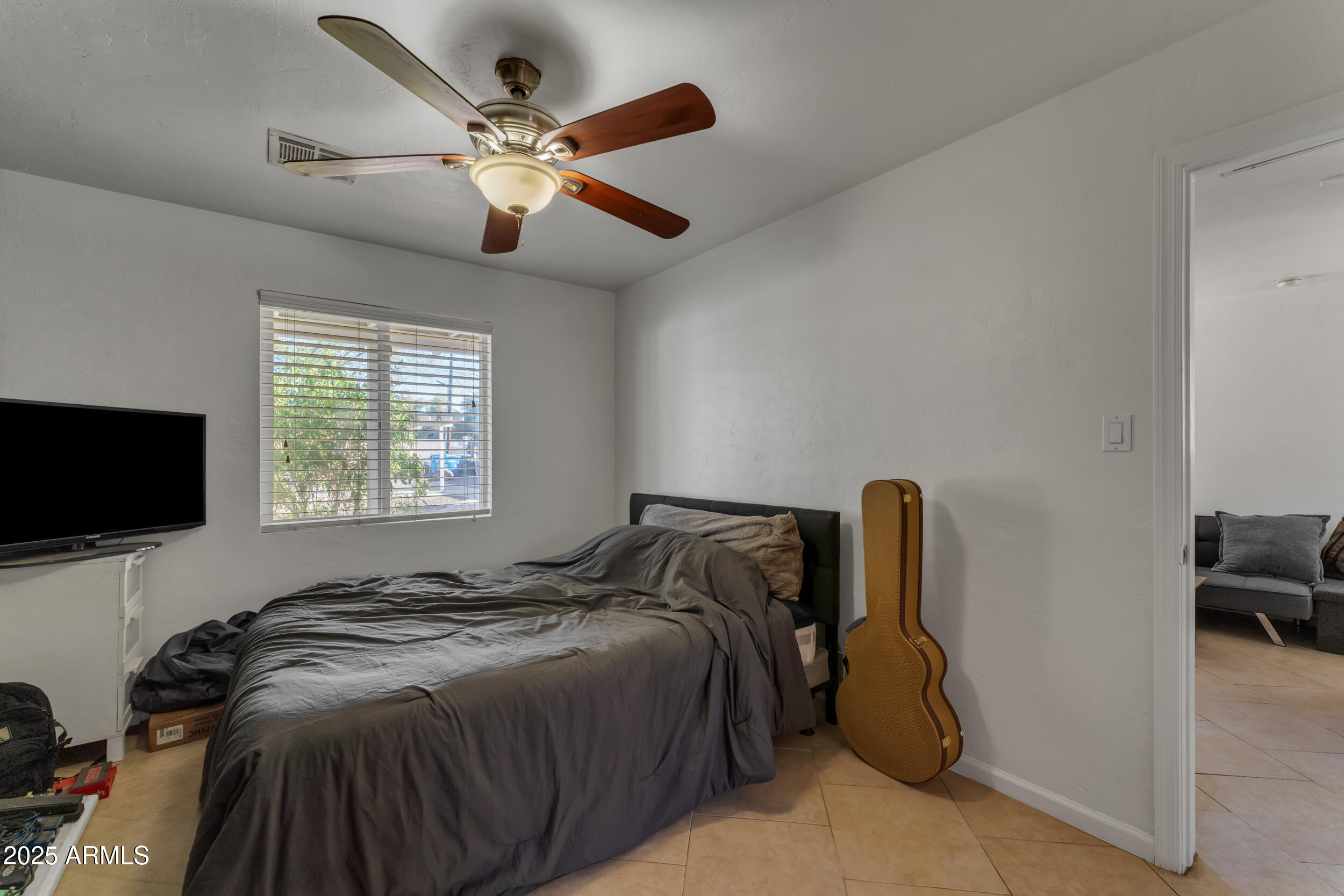 1024 East Mitchell Drive Phoenix, AZ 85014 - Photo 40 of 44 a bed sitting in a room next to a window