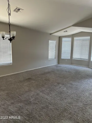 a view of a big room with windows