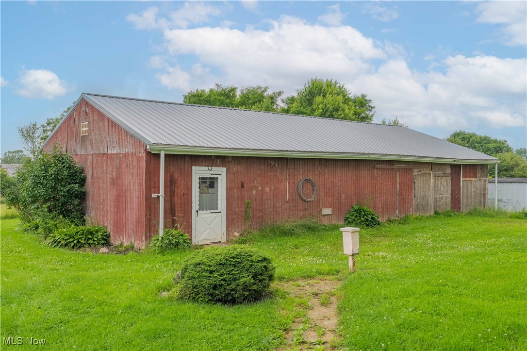 15544 West Calla Road Beloit, OH 44609 - Photo 14 of 40 View of pole building with a yard