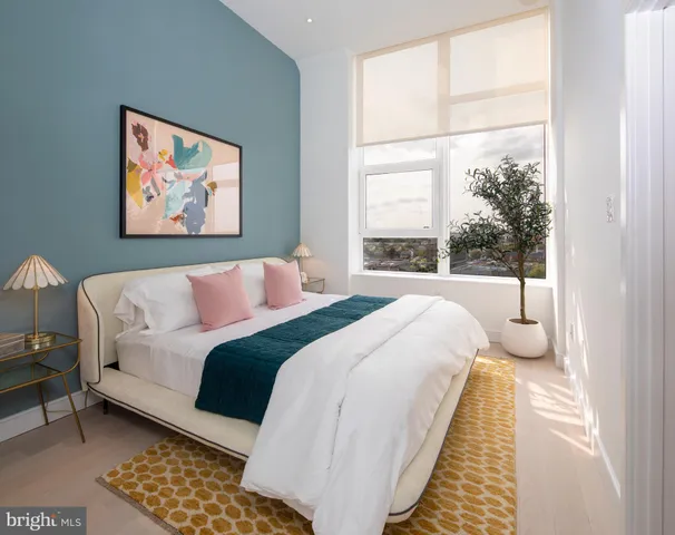 a bedroom with bed and window