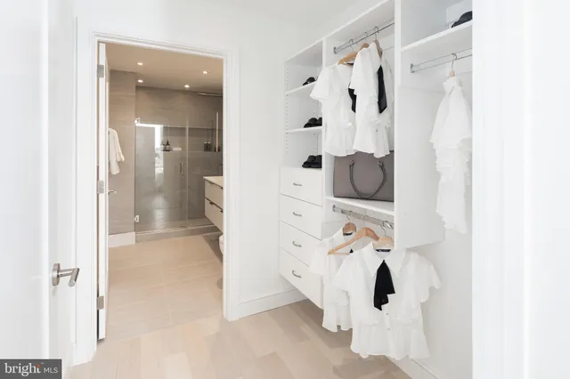 a bathroom with a bathtub and shower