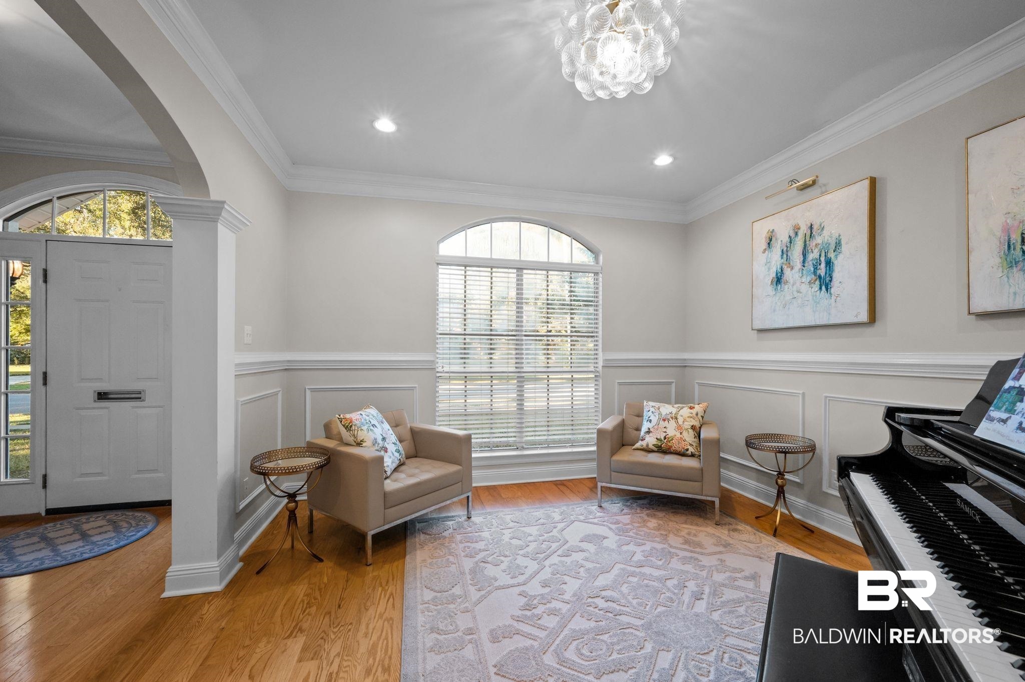 1825 Spring Hill Avenue Mobile, AL 36607 - Photo 9 of 43 Sitting room featuring light wood-type flooring, arched walkways, a decorative wall, wainscoting, and ornamental molding