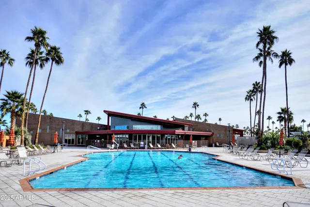 a view of a lake with palm trees