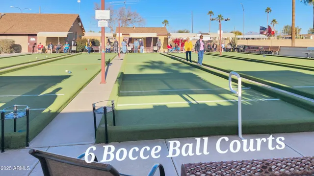 a view of a tall building with a palm tree in the background