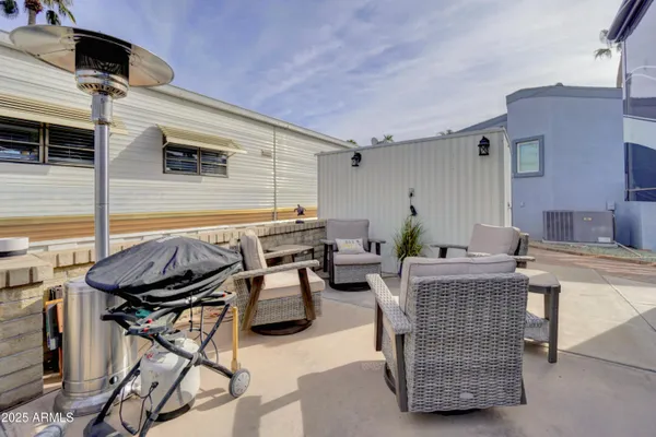 a patio with table and chairs