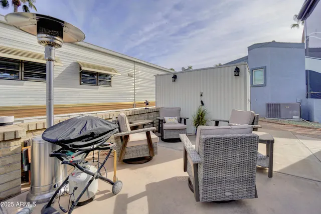 a patio with table and chairs