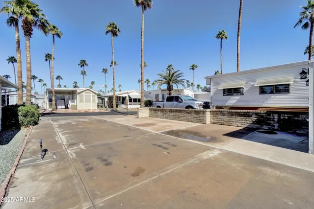 a view of a patio with a table and chairs