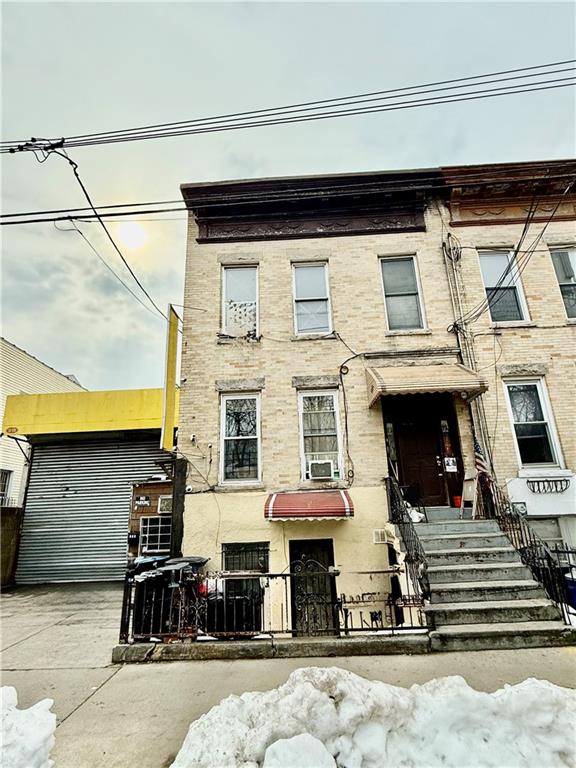 916 62nd Street Brooklyn, NY 11219 - Photo 1 of 3 a view of a building with car parked