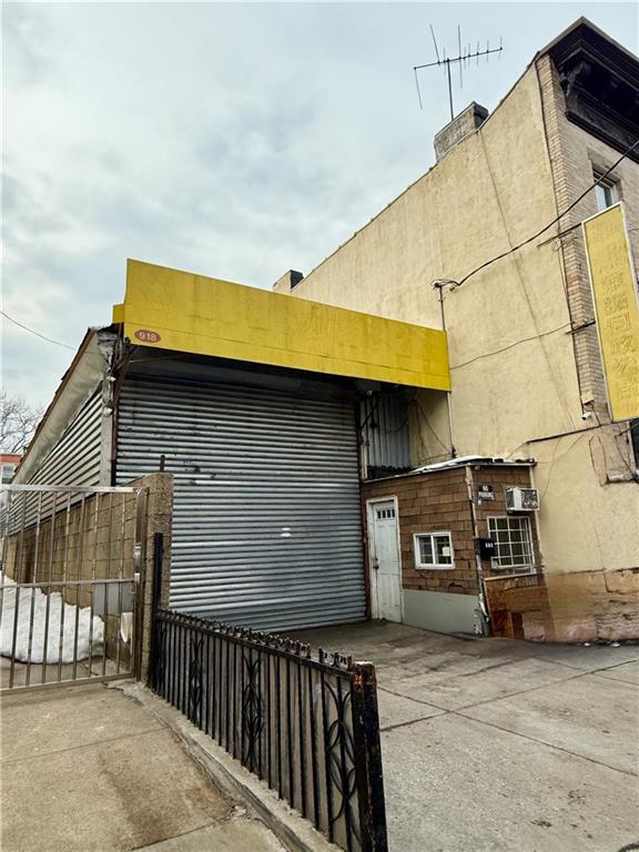 916 62nd Street Brooklyn, NY 11219 - Photo 3 of 3 a front view of a house with parking area