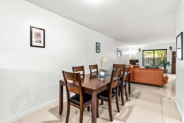 a view of a dining room with furniture and a livingroom