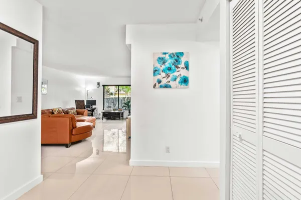 a view of an entryway and livingroom