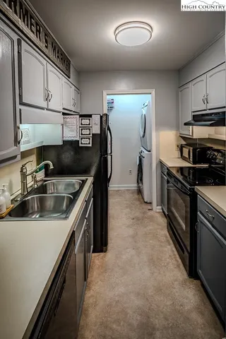 a kitchen that has a sink and a stove