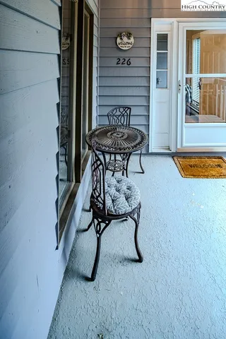 a swimming pool with outdoor seating